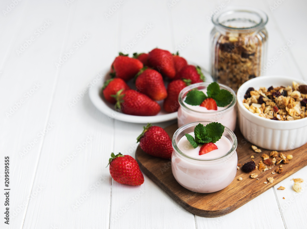 healthy breakfast, yogurt, fresh strawberries and granola healthy breakfast, yogurt, fresh strawberries and granola
