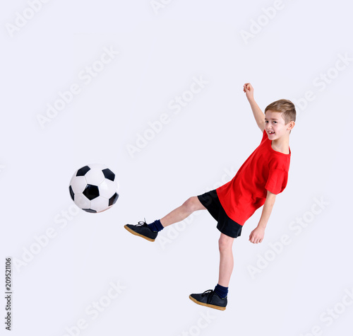 boy in red shirt with soccer ball © Firma V