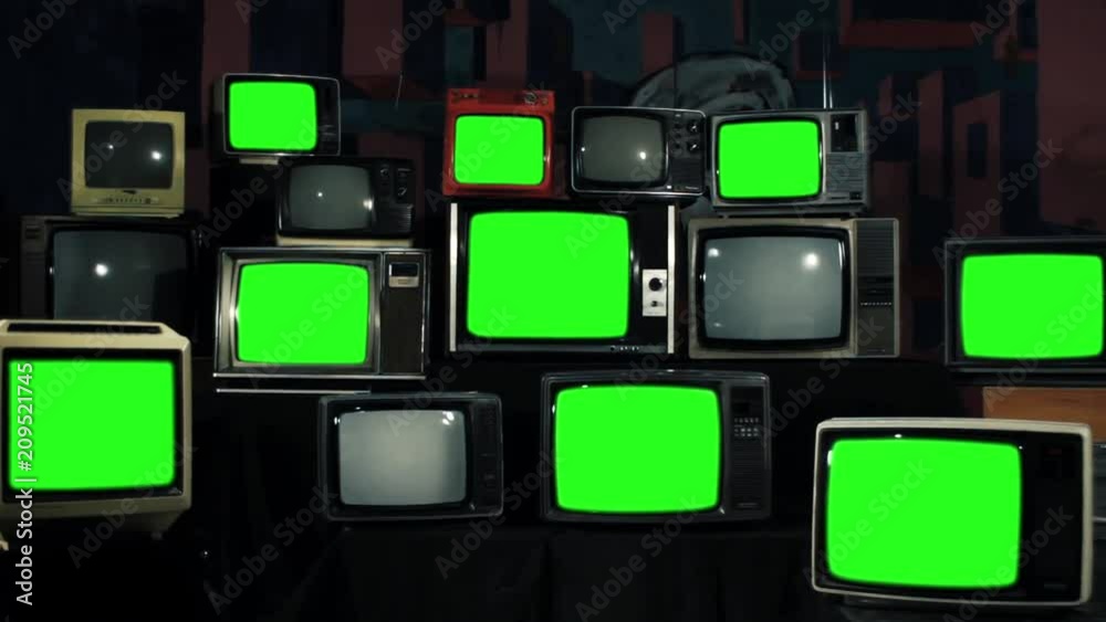 Vídeo do Stock Many Tvs with Green Screens. Zoom In. Aesthetics of the