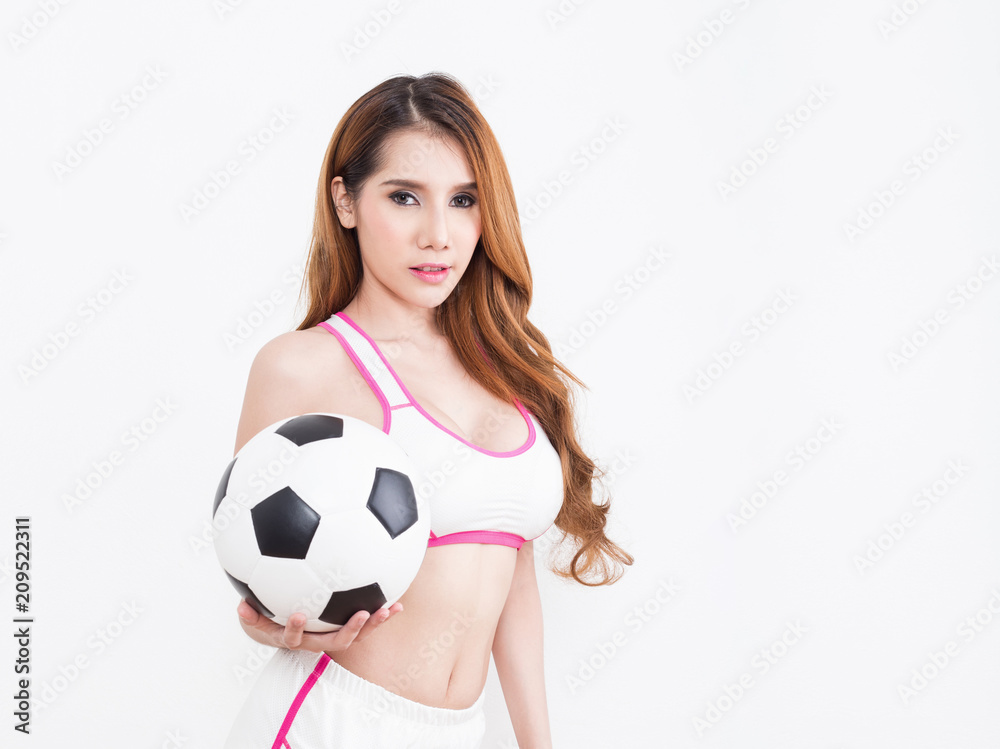 Young sexy woman with soccer ball