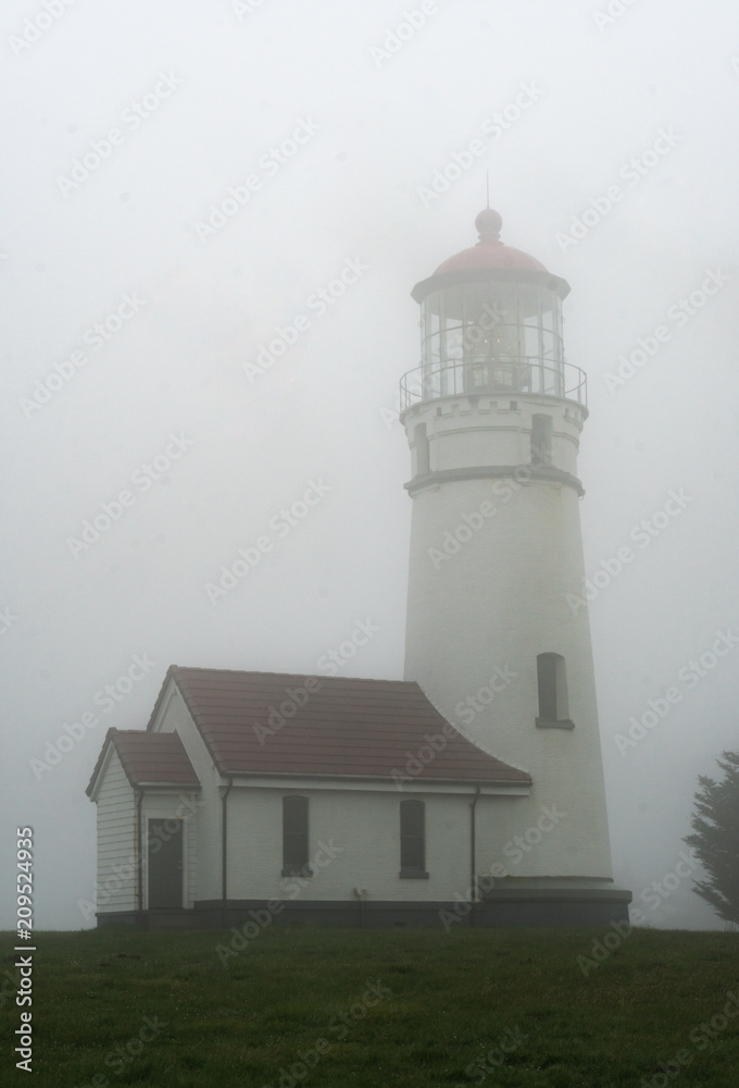 Cape Blanco Lighthouse on a foggy evening near Bandon on the Oregon Coast