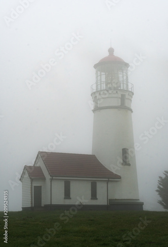 Cape Blanco Lighthouse on a foggy evening near Bandon on the Oregon Coast