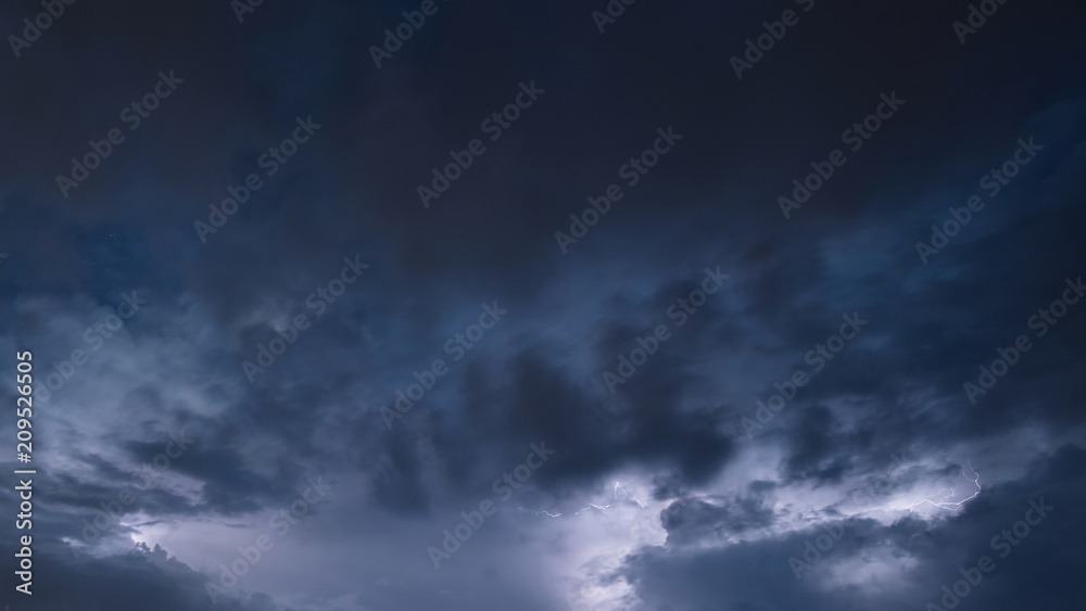 Powerful lightning storm raging in moody dramatic sky Powerful lightning storm raging in moody dramatic sky