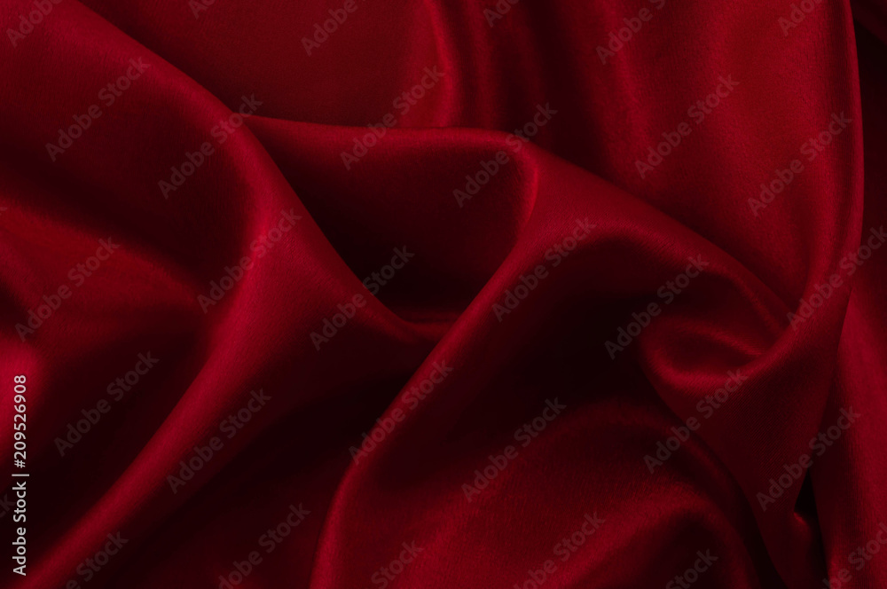Obraz premium Abstract silk luxury background, piece of cloth, deep red cloth texture