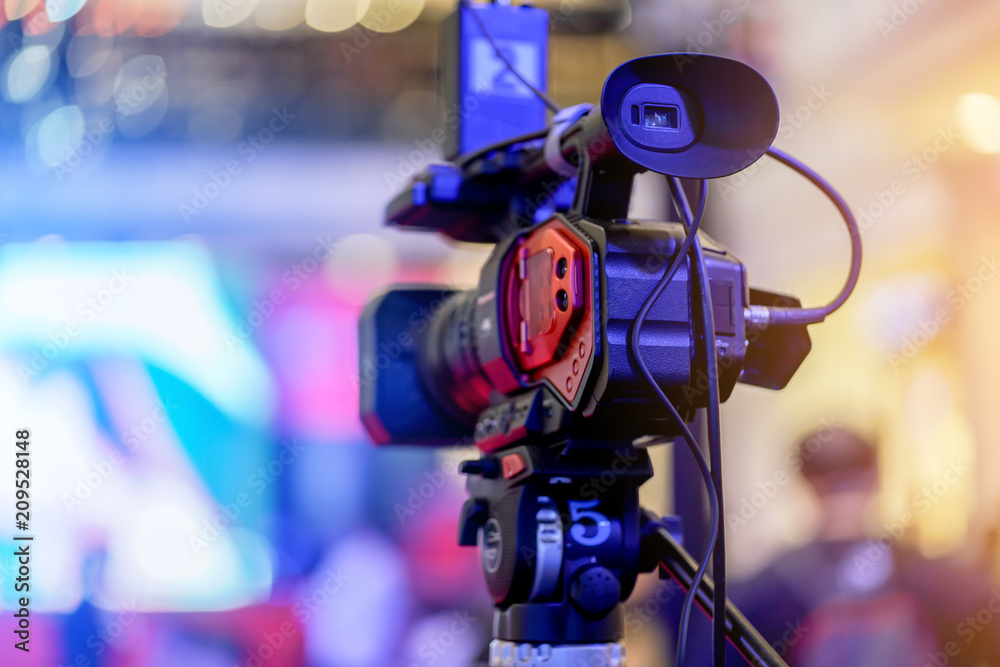 event camera in a event hall. TV broadcast of the event from public space area event camera in a event hall. TV broadcast of the event from public space area