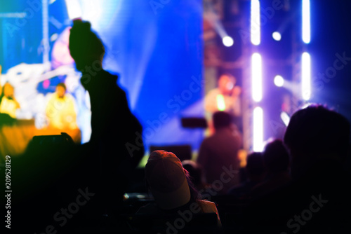 people enjoy music live band in concert with spotlight and music performance © whyframeshot