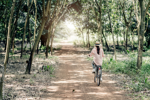Wallpaper Mural asian woman with vntage bicycle in forest travel ideas concept Torontodigital.ca