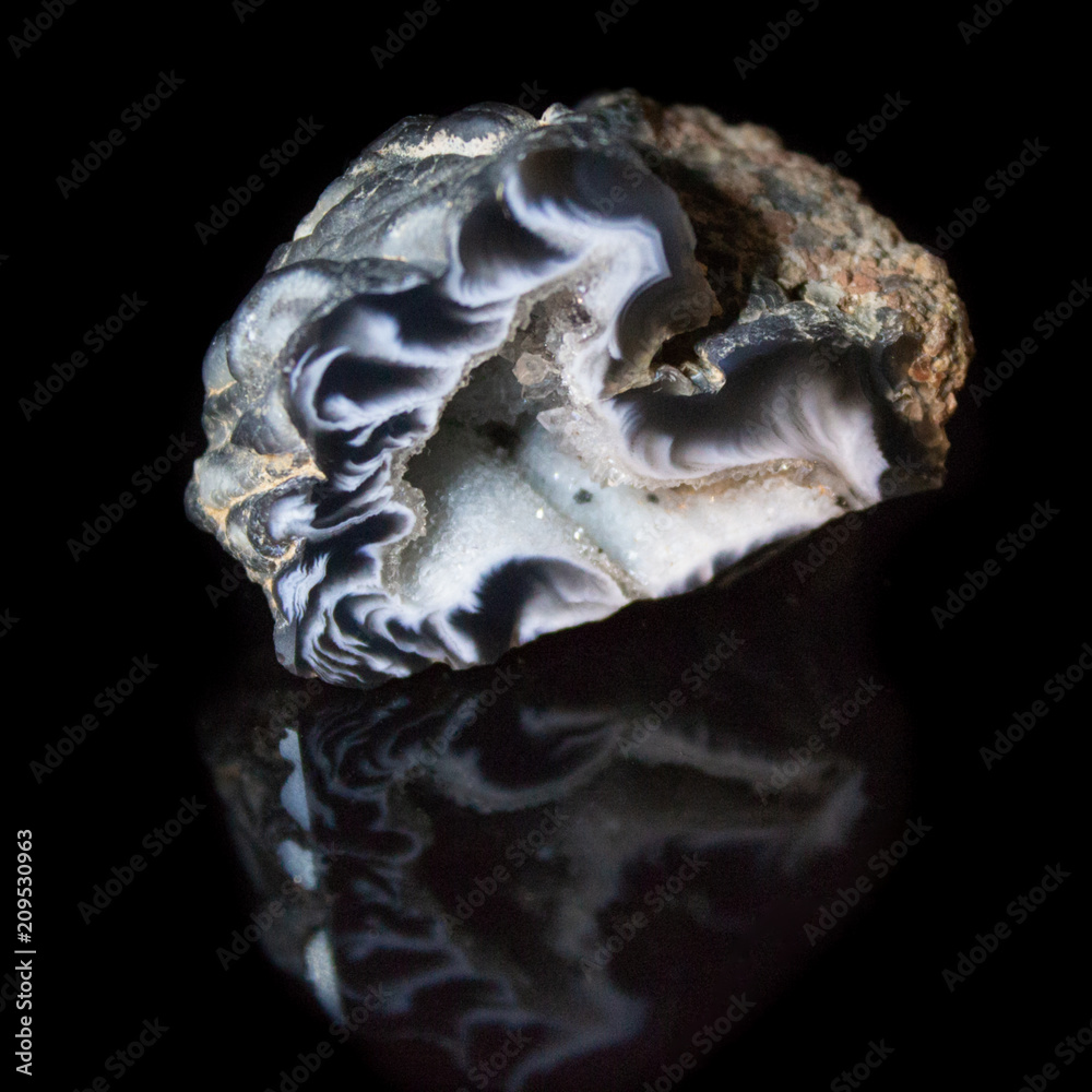 Natural geode polished agate on a black background Natural geode polished agate on a black background