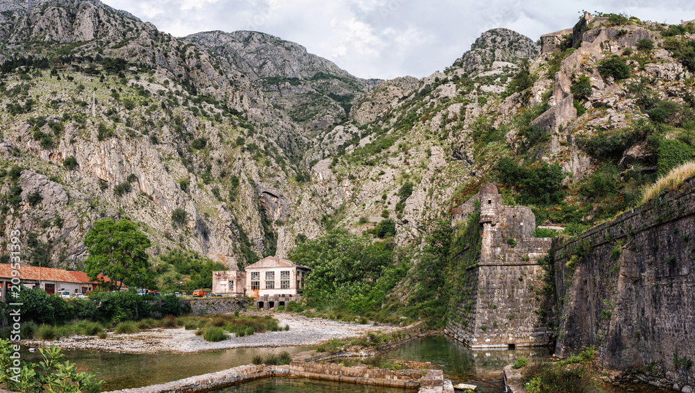 Panoramic view to mountains and old historical city wall in the ancient town of Kotor, Montenegro