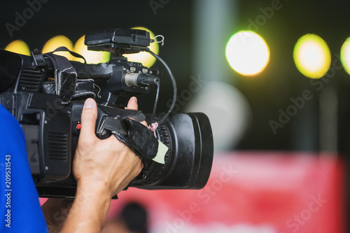 Video camera operator working with his equipment