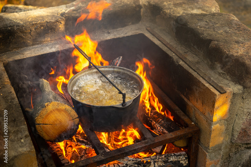 Cooking food at the stake. ...