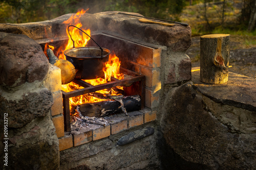Cooking food at the stake. ...