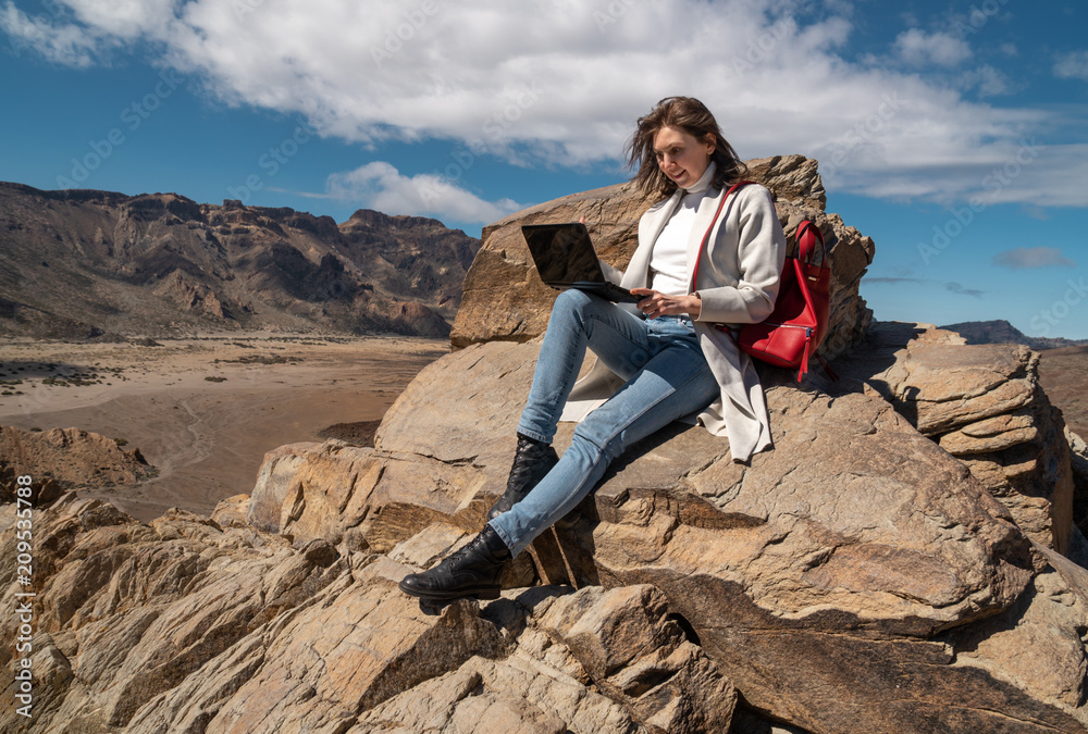 girl with laptop on mountain landscape background girl with laptop on mountain landscape background
