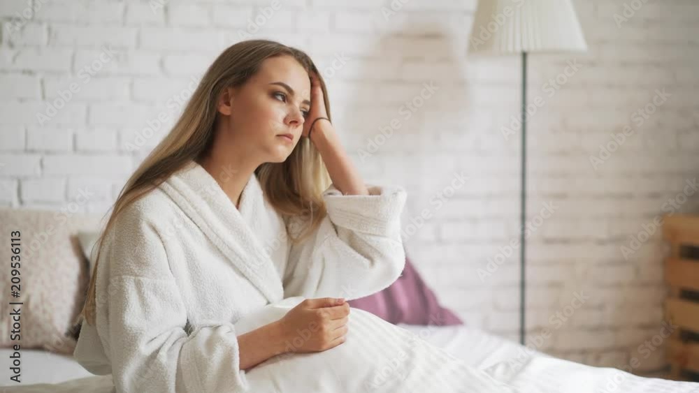 Nervous blonde with dandruff on her head, scratching her skin. Irritation, itching of the head Nervous blonde with dandruff on her head, scratching her skin. Irritation, itching of the head
