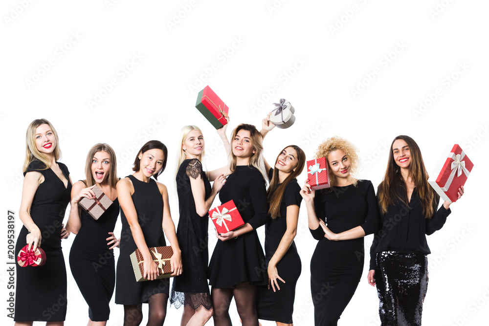 Women in black dress with gifts in hands isolated.