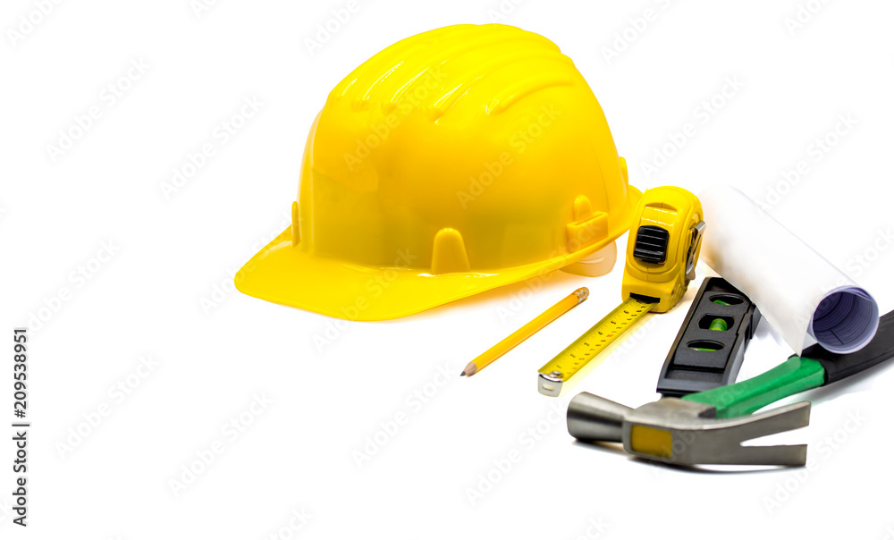 Yellow hard hat with blueprints and pencil,tape measure,hammer,construction bubble level isolated on white background,Copy space,with clipping Path Yellow hard hat with blueprints and pencil,tape measure,hammer,construction bubble level isolated on white background,Copy space,with clipping Path