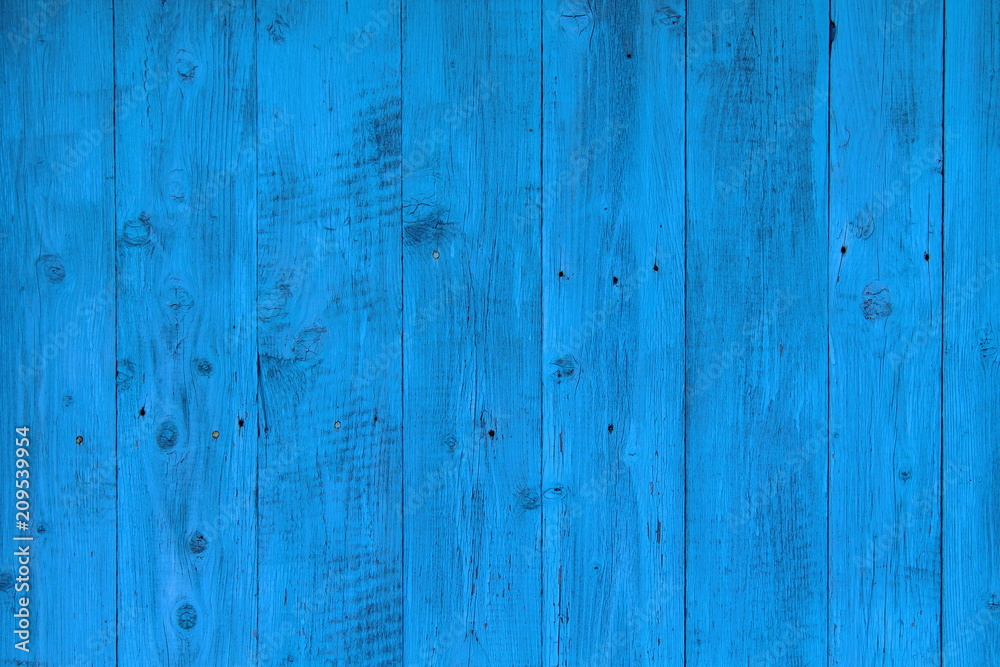 Background of old boards painted in blue. The wall of the house. Close-up. Background. Texture.