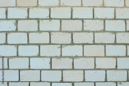 The wall of the house is made of white silicate brick. Close-up. Background. Texture.