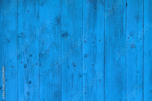 Background of old boards painted in blue. The wall of the house. Close-up. Background. Texture.