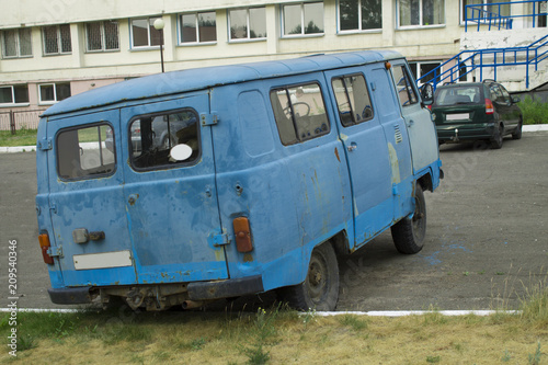 an old rusty minibus on the street