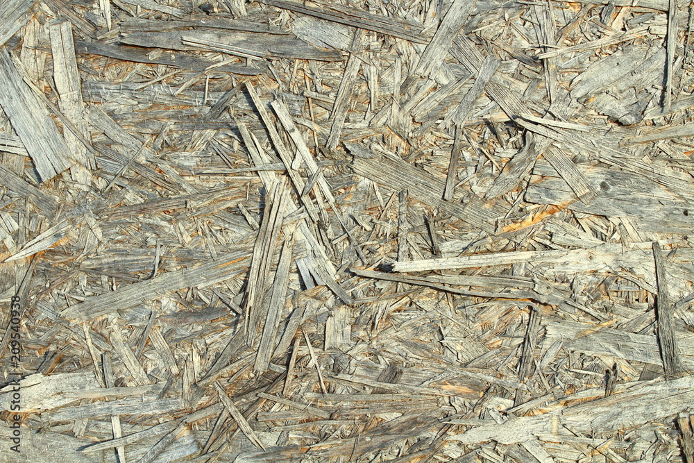 The old pressed plywood. Close-up. Background. Texture. The old pressed plywood. Close-up. Background. Texture.