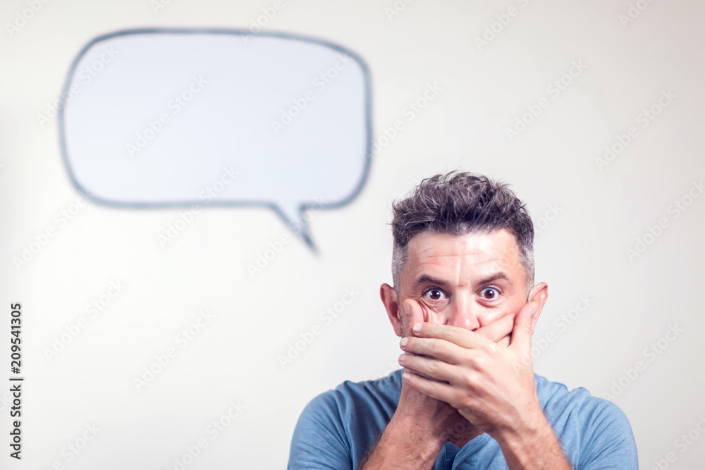 Portrait of a young man with a empty speech bubble over his head Portrait of a young man with a empty speech bubble over his head