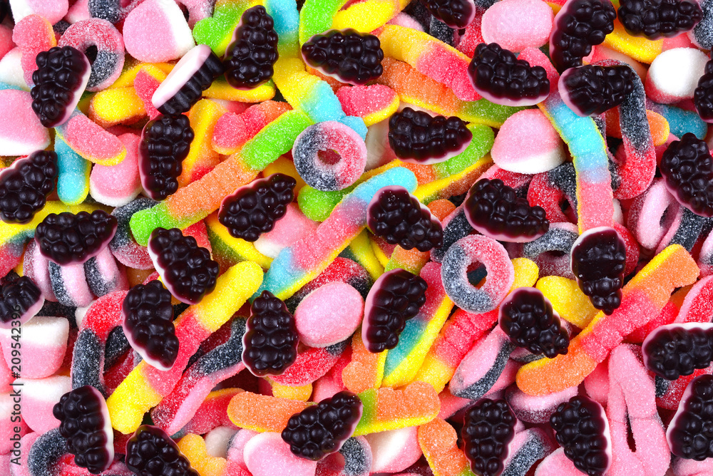 Assorted juicy colorful gummy candies. Top view. Candy background.
