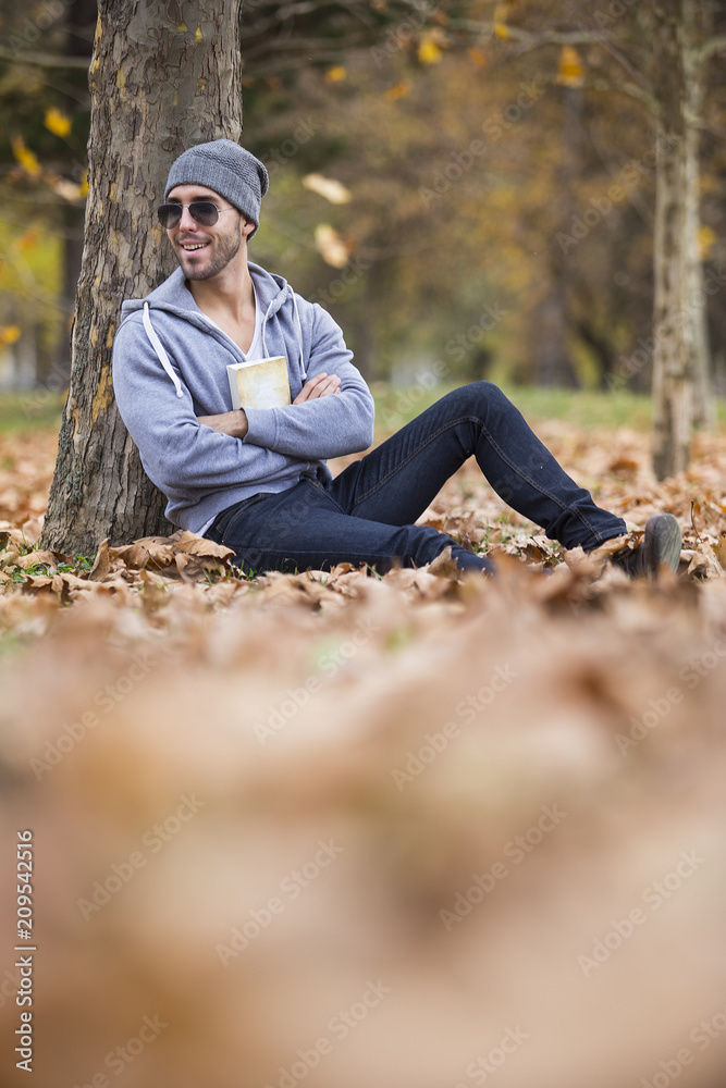 man in nature .autumn leaves.copy space