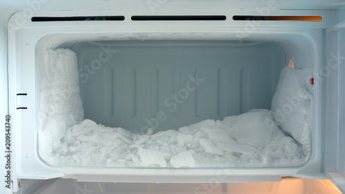 Ice buildup in an empty refrigerator.