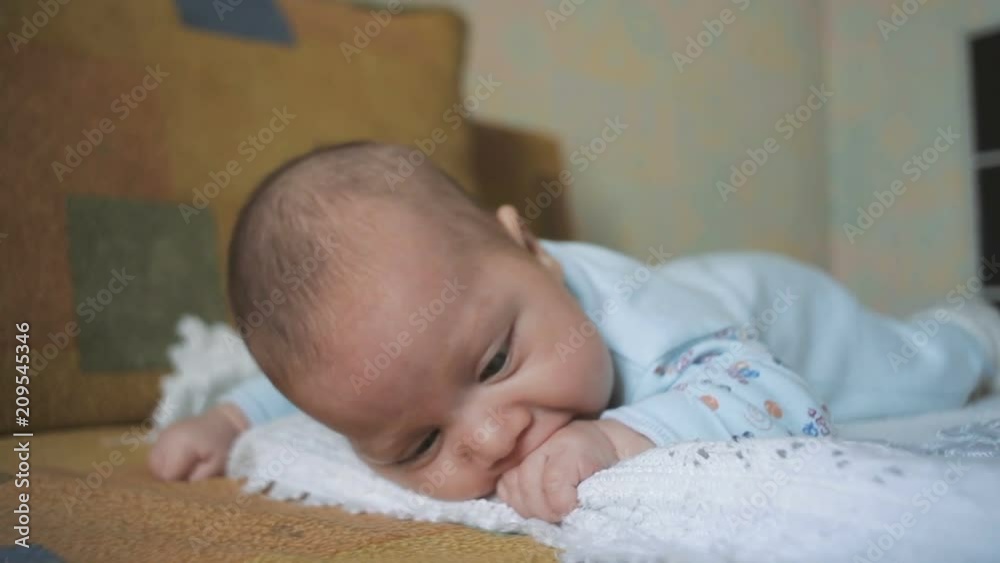 Newborn hungry baby eats her own hand Newborn hungry baby eats her own hand