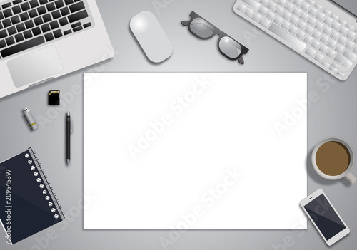 Workplace with tablet computer and mobile phone on table