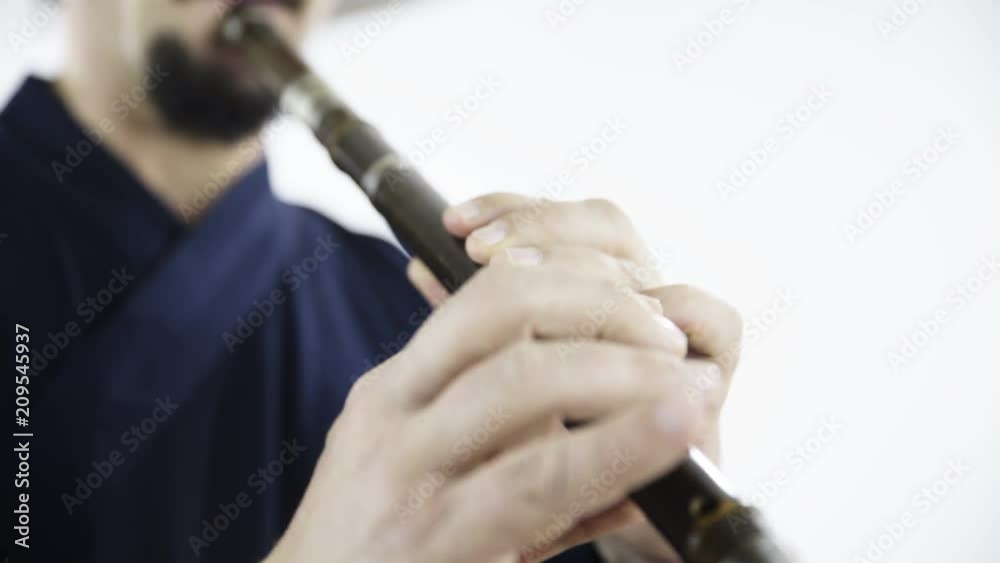 Vidéo Stock Inspired traditional bamboo flute playing close up 4K