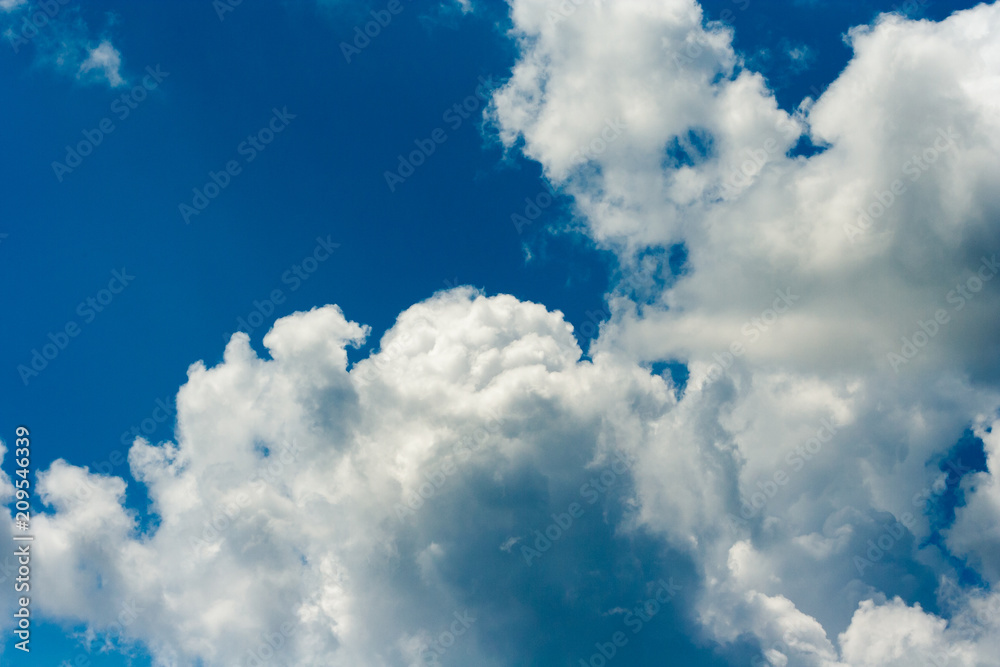 Obraz premium amazing white clouds on blue sky in summer day. Good sunny weather