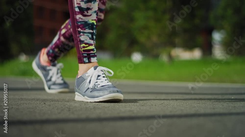 Sports girl starts to run or run. Slow motion. Close up photo