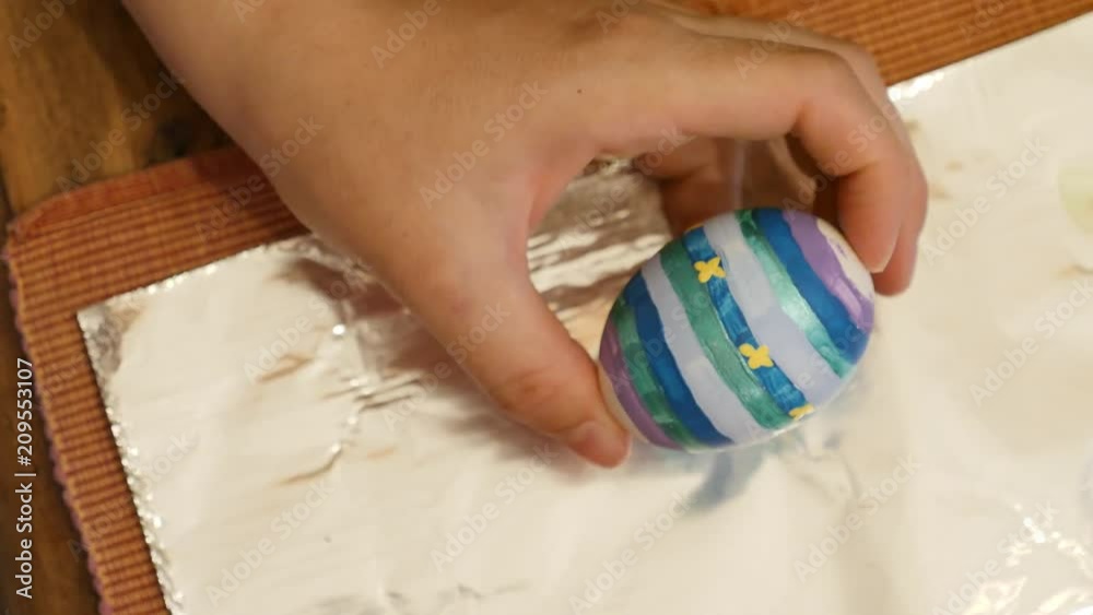 A woman painting eggs for easter holiday A woman painting eggs for easter holiday