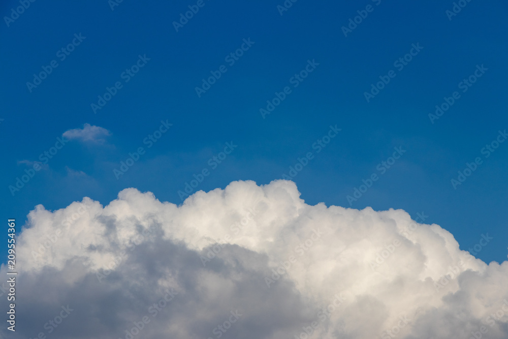 white clouds on the blue sky background white clouds on the blue sky background