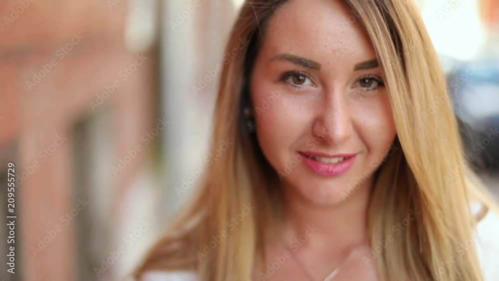 Close up portrait of beautiful caucasian blonde girl on the street Close up portrait of beautiful caucasian blonde girl on the street