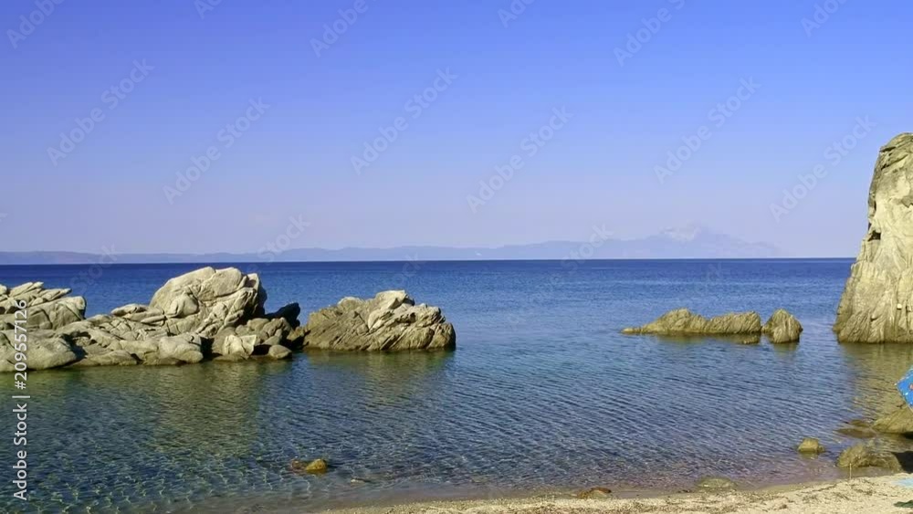 Tropical sandy beach with large rocks and blue sea Tropical sandy beach with large rocks and blue sea