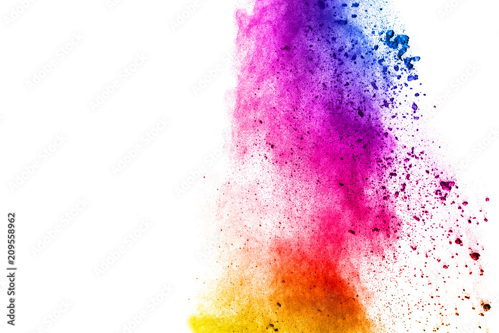 Abstract multi color powder explosion on white background.  Freeze motion of  dust  particles splashing. Painted Holi in festival