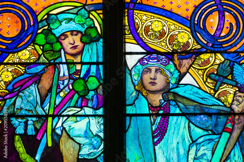Detail of art nouveau stained glass window by Alfons Mucha, St. Vitus Cathedral, Prague castle, Czech Republic - women who symbolize Czech and Slovakian people
