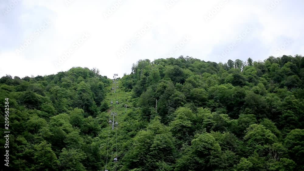 Beautiful mountains, forests and cable cars rising to the top. Nature, resort Beautiful mountains, forests and cable cars rising to the top. Nature, resort