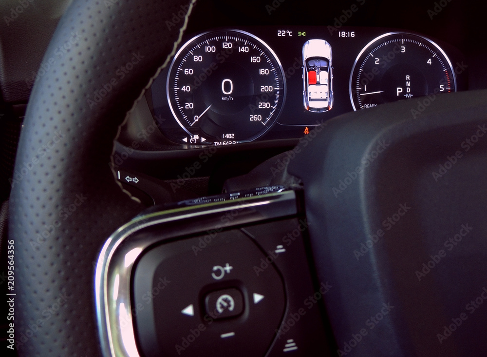 Car dashboard and controls  buttons of cruise control on the steering wheel 
