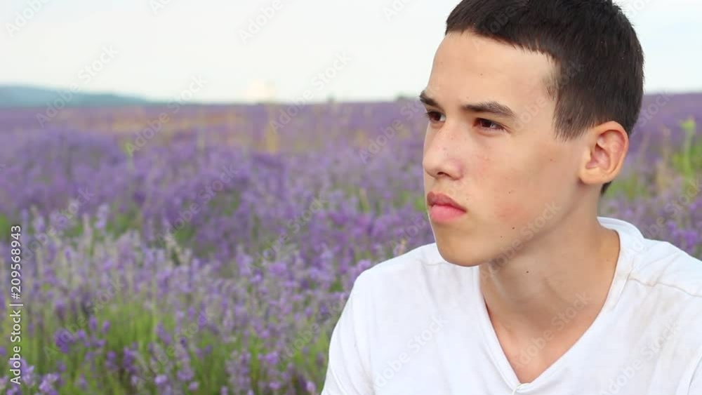 Dreamy Young Teen Boy. Portrait Of Lonely Depressed Boy Alone In A Lavender Field Dreamy Young Teen Boy. Portrait Of Lonely Depressed Boy Alone In A Lavender Field