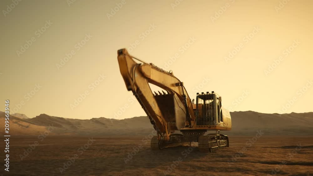 Big excavator machine working on an empty, dark, foggy construction site. 4KHD