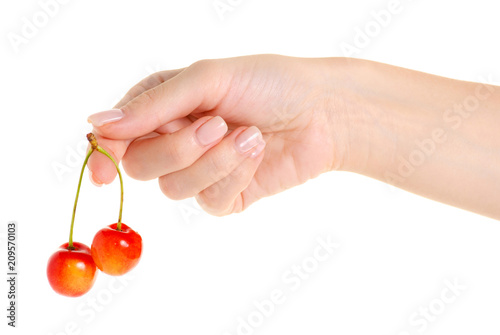 Cherries in hand on a white background isolation