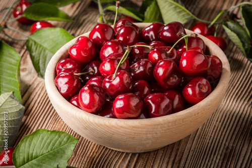 Sweet cherries in a wooden bowl.