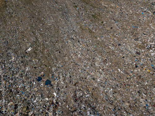 Environmental pollution. Aerial top view photo from flying drone of large garbage pile. Garbage pile in trash dump or landfill.
