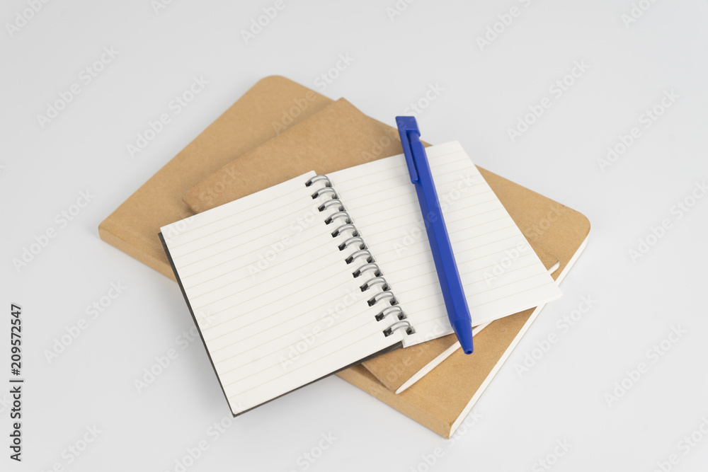 Stationery set such as Note books and Pens on white background. Stationery set such as Note books and Pens on white background.