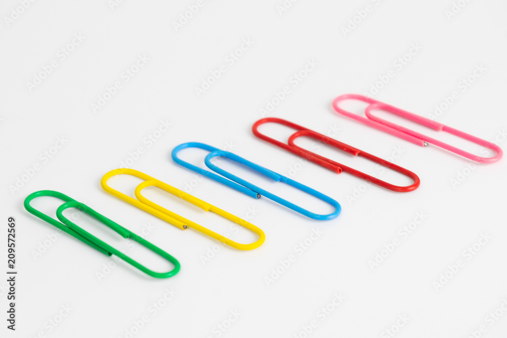 Colorful paper clips on white background. Colorful paper clips on white background.