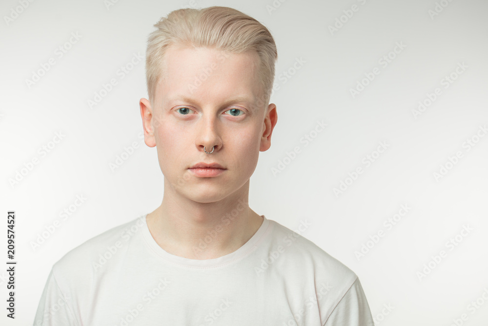 Portrait of well-groomed young blond male model with blue eyes, perfect  skin isolated on white background Stock Photo | Adobe Stock